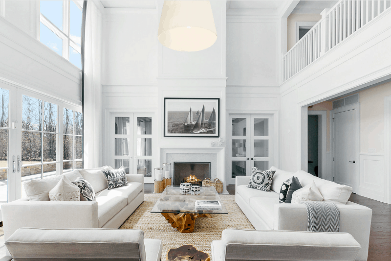 Coastal home décor featuring rattan furniture, nautical accents, and a soothing ocean-inspired colour palette with blue and white tones